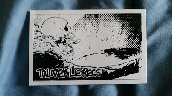To Live A Lie - Skullguy white sticker (image for) To Live A Lie - Skullguy white sticker
