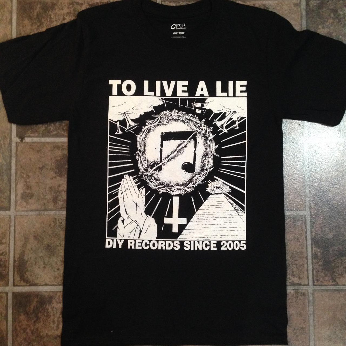TLAL 10 Year Anniversary Merch: shirts, enamel pins, and embroidered patches